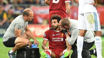 Mohamed Salah receives treatment following his injury in the Uefa Champions League final. Michael Regan / Getty Images