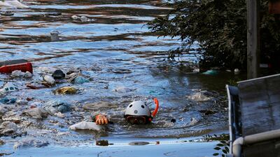 A rescue worker swims as he checks around a flooded residential area due to Typhoon Hagibis, in Kawasaki, Japan. Reuters
