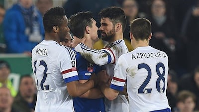 Chelsea's Diego Costa confronts Everton's Gareth Barry during their teams' FA Cup quarter-final contest on Saturday night at Goodison Park. Paul Ellis / AFP / March 12, 2016