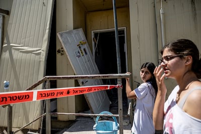 Settlers in the occupied West Bank check damage after Iran launched missiles towards Israel. Reuters