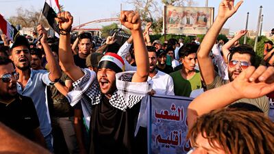 Protesters chant slogans demanding jobs and better public services in Basra, Iraq, in August 2018. AP