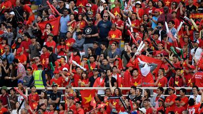 Vietnam supporters cheer during the match at Nahyan Stadium in Abu Dhabi. AFP