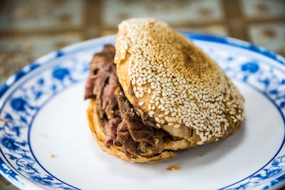 Beijing-style shaobing is a baked, unleavened, layered flatbread with sesame seeds and braised beef filling. Getty Images