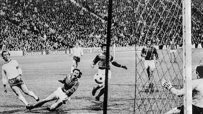 Franz Beckenbauer, left, opens the scoring for Bayern Munich against St Etienne in the European Cup semi-final of 1975. AFP