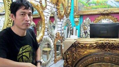 Li Guohui, a partner in Xin You Photo Frame Oil Painting. Daniel Bardsely / The National