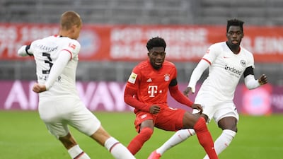 Bayern Munich's Alphonso Davies, closes down Eintracht Frankfurt's Stefan Ilsanker. AP