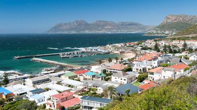 False Bay and Kalk Bay harbour. The area, to the south of Cape Town, comprises several seaside suburbs. Eric Nathan / Alamy Stock Photo