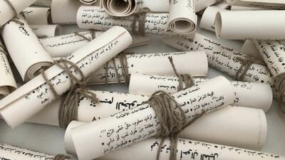 Manal AlDowayan makes porcelain scrolls out of an Abbasid-era text of jurisprudence that her father had in his library, frustrating the viewer's desire for total knowledge of the work.