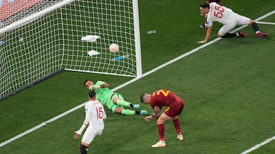 Roma's Gianluca Mancini, centre, reacts after scoring an own goal. AP
