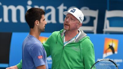 World No 1 Novak Djokovic, left, listens to his coach, German tennis legend Boris Becker during a training session at the Australian Open tennis tournament in Melbourne. AFP PHOTO / MAL FAIRCLOUGH