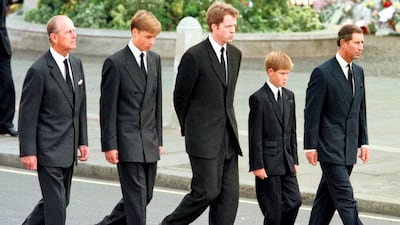 The princes William and Harry with (L to R) their grandfather, Prince Philip, their uncle, Earl Spencer, and their father, Prince Charles in the funeral cortege for Diana, Princess of Wales, on September 6, 1997. The Princess died on August 31, 1997 in a car accident in Paris. Jeff J. Mitchell / RTA/WPA Pool / AFP