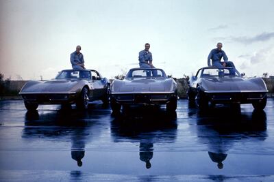 The crew of Apollo 12 with their Corvette Stingrays in 1969. Getty