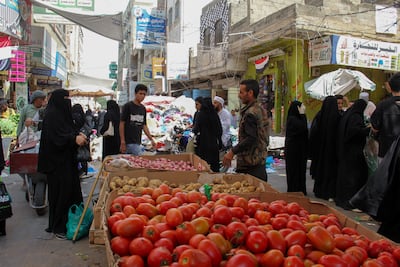 People shop at a market in Taiz. The UN warns prices have doubled due to the conflict. Reuters
