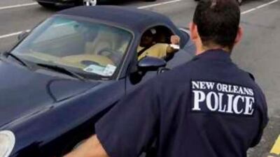 New Orleans police officers help guide the flow of traffic returning to the city.