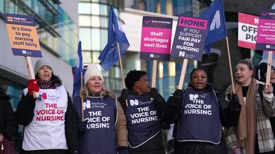 Members of the Royal College of Nursing on the picket line outside Queen Elizabeth Hospital in Birmingham, as nurses in England, Wales and Northern Ireland strike over pay. PA