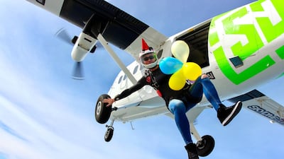 A professional skydiver and canopy pilot competitor Olga Naumova jumps out of an airplane about 10 times a day
