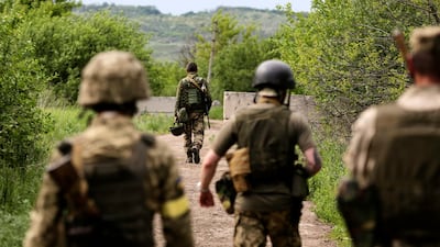 Ukrainian servicemen move to their positions near Zaytseve village, south of Severodonetsk, in the Donetsk region. EPA