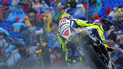 The Fiat Yamaha rider Valentino Rossi negotiates a bend during his successful qualifying race at the Sachsenring.