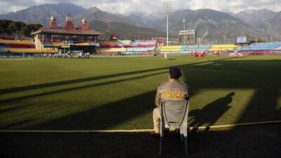 A policeman keeps a lookout at the Himachal Pradesh Cricket Association (HPCA) stadium in Dharmsala, India, Tuesday, March 8, 2016. The venue, which hosts several ICC Twenty20 World Cup matches, will hold the first match between Bangladesh and the Netherlands on March 9. (AP Photo/Ashwini Bhatia)