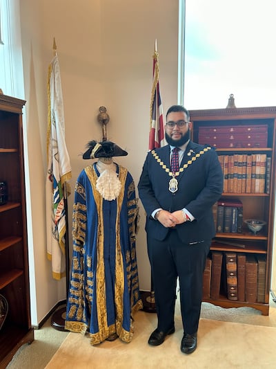 Lord Mayor of Westminster Hamza Taouzzale poses with his ceremonial robes as he prepares to attend King Charles III's coronation. Photo: Laura O'Callaghan / The National
