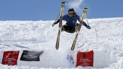 An Afghan Hazara competitor launches himself during the third annual Afghan Ski Challenge in the Shahidan Valley of Bamiyan province.