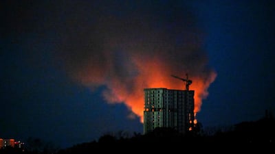 Smoke rises over Kyiv. AFP