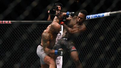 UFC 248 was the last fight night to take place, in Las Vegas on March 8, before the lockdown on sports events. Here Israel Adesanya fends off Yoel Romero during their middleweight title fight at T-Mobile Arena. AFP