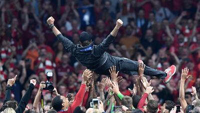 Jurgen Klopp is hoisted in the air in celebration after Liverpool's win over Tottenham. Getty