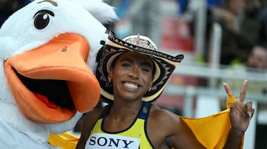 Colombia's Natalia Linares celebrates silver with mascot Goosia in the women's final long jump event during the World Athletics Indoor Championships Kujawy Pomorze 2026 in Torun, Poland. AFP