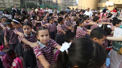 Egyptians students do their morning exercise on the first day of the new school term in the Nasr City neighborhood of Cairo on 21 September 2014. Khaled Elfiqi/EPA