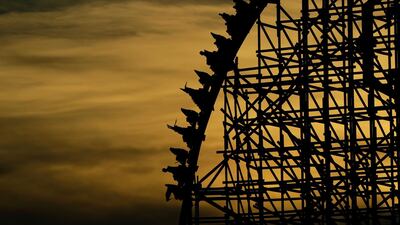 Visitors to theme park Six Flag Fiesta Texas are spaced apart on a ride in San Antonio. US. AP