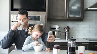 When it comes to phones, it is important to set rules, for example, no devices during mealtimes. Getty Images