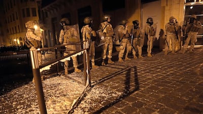 Army soldiers deploy on a street where anti-government protesters clash with riot police. AP Photo