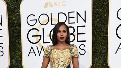 Kerry Washington wore a glimmering gold lace column dress. The decorated buckle was overkill but we’re still giving the overall look a thumbs up. Valerie Macon / AFP