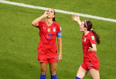 Alex Morgan of the United States celebrates after scoring their second goal against England. Lucy Nicholson / Reuters