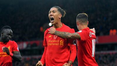 Liverpool’s Roberto Firmino celebrates scoring his side’s fourth goal. Dave Howarth / PA / AP
