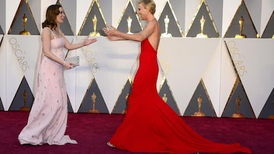Emily Blunt, left, and Charlize Theron arrive for the 88th annual Academy Awards ceremony at the Dolby Theatre in Hollywood, California. Mike Nelson / EPA