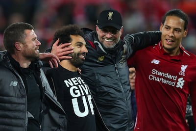 Jurgen Klopp, Manager of Liverpool and Mohamed Salah of Liverpool and team mates celebrate in 2019 at Anfield. (Photo by Clive Brunskill/Getty Images)