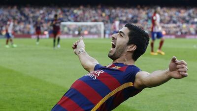Luis Suarez of Barcelona celebrates scoring the team’s second goal in their 2-1 win on Saturday over Atletico Madrid. Manu Fernandez / AP