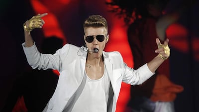 Justin Bieber has apologised for his behaviour in a video, which was taken when was 15, that shows him telling a racist joke. Albert Gea / Reuters