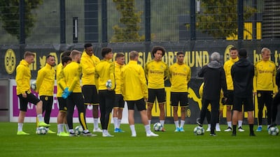 Dortmund's Swiss coach Lucien Favre oversees a training session of his players on the eve of the UEFA Champions League Group F football match between Borussia Dortmund and Barcelona in Dortmund, western Germany, on September 16, 2019. / AFP / SASCHA SCHUERMANN