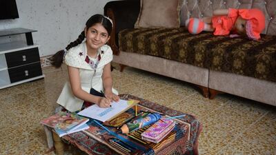 Raya has learnt to read and write at a centre run by Save the Children in Iraq. Photo: Save the Children
