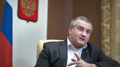 Crimean prime minister Sergei Aksyonov has defended the decision to forcibly take over dozens of businesses and properties since coming to power in March. Alexander Zemlianichenko / AP Photo