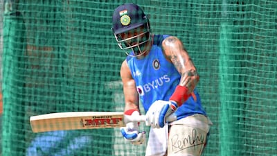 Virat Kohli bats during a practice session at the Punjab Cricket Association Stadium in Mohali. AFP