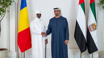 The leaders exchange a handshake before holding a meeting at Al Shati Palace
