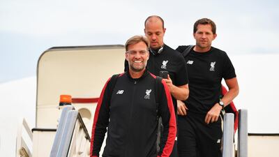 epa06761289 A handout photo made available by the UEFA of Liverpool manager Juergen Klopp (L) arriving ahead of the UEFA Champions League final at IEV Airport in Kiev, Ukraine, 24 May 2018. Liverpool FC will face Real Madrid in the UEFA Champions League final at the NSC Olimpiyskiy stadium in Kiev on 26 May 2018. EPA/UEFA / HANDOUT HANDOUT EDITORIAL USE ONLY/NO SALES
