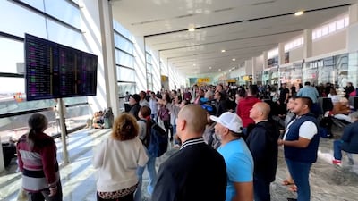 Travellers gather at Guadalajara airport Gang violence has caused heavy disruption in Mexico. Reuters