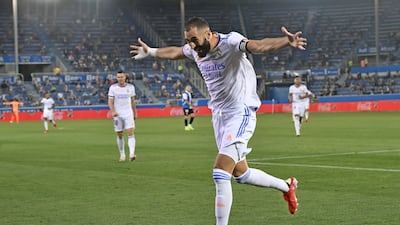 Benzema celebrates after scoring his side's third goal.