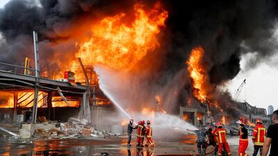 Lebanese firefighters try to extinguish a fire at the Beirut port. EPA