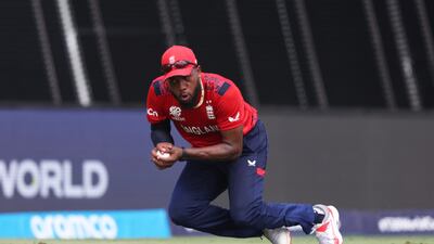 England's Chris Jordan takes a catch to dismiss Harmeet Singh of the USA for 21 off the bowling of Sam Curran. Getty Images